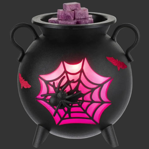 Black cauldron wax warmer with a spider and glowing pink web.