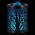 Black spooky tree wax warmer with glowing blue woodland design and wax melts in the top dish.