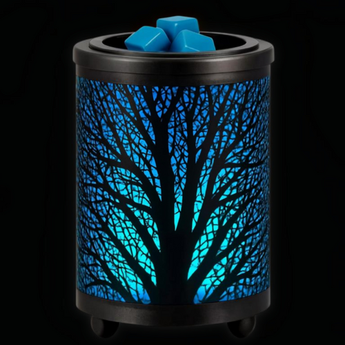 Black spooky tree wax warmer with glowing blue woodland design and wax melts in the top dish.
